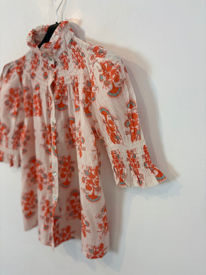 OTRAS. Blusa estampada nido de abeja