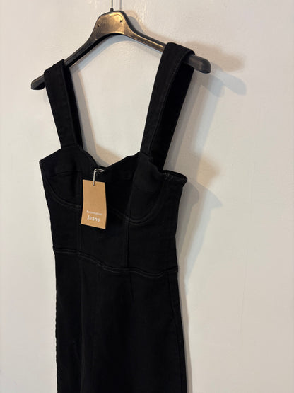 REFORMATION. Mono negro denim