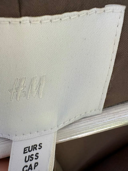 H&M. Gabardina larga verde oscuro