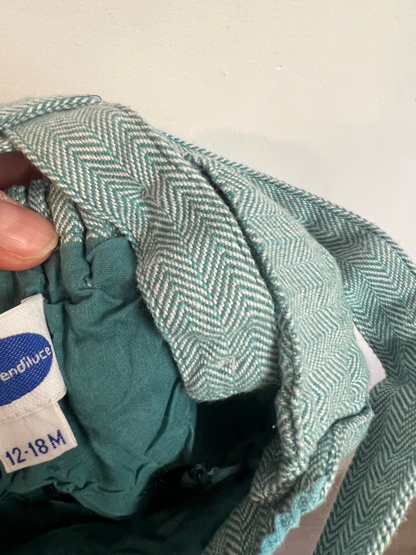 PATRICIA MENDILUCE. Ranita algodón azul claro jaspeado. T 12-18 meses