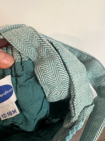 PATRICIA MENDILUCE. Ranita algodón azul claro jaspeado. T 12-18 meses