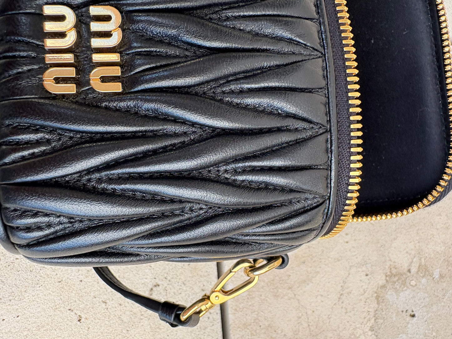 MIU MIU. Matelassé nappa leather micro bag