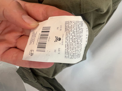 SCALPERS. Striped green vest. TM