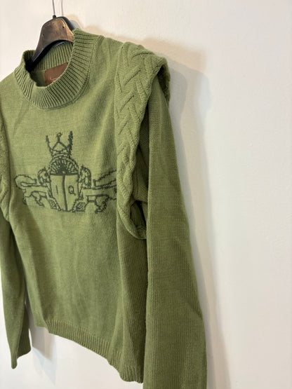 IQ. Jersey verde dibujo con lana