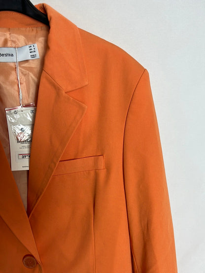 BERSHKA. Total look naranja T.s