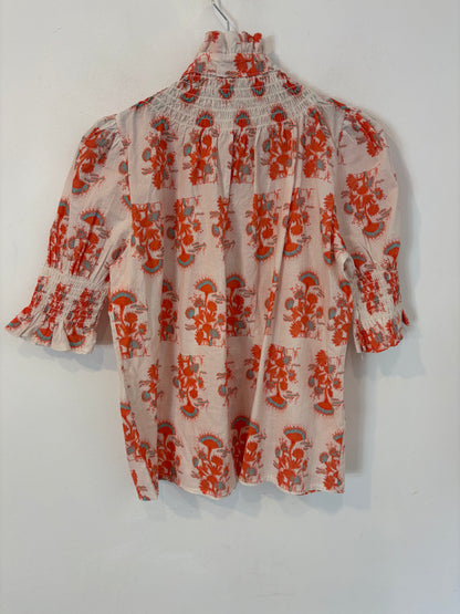 OTRAS. Blusa estampada nido de abeja