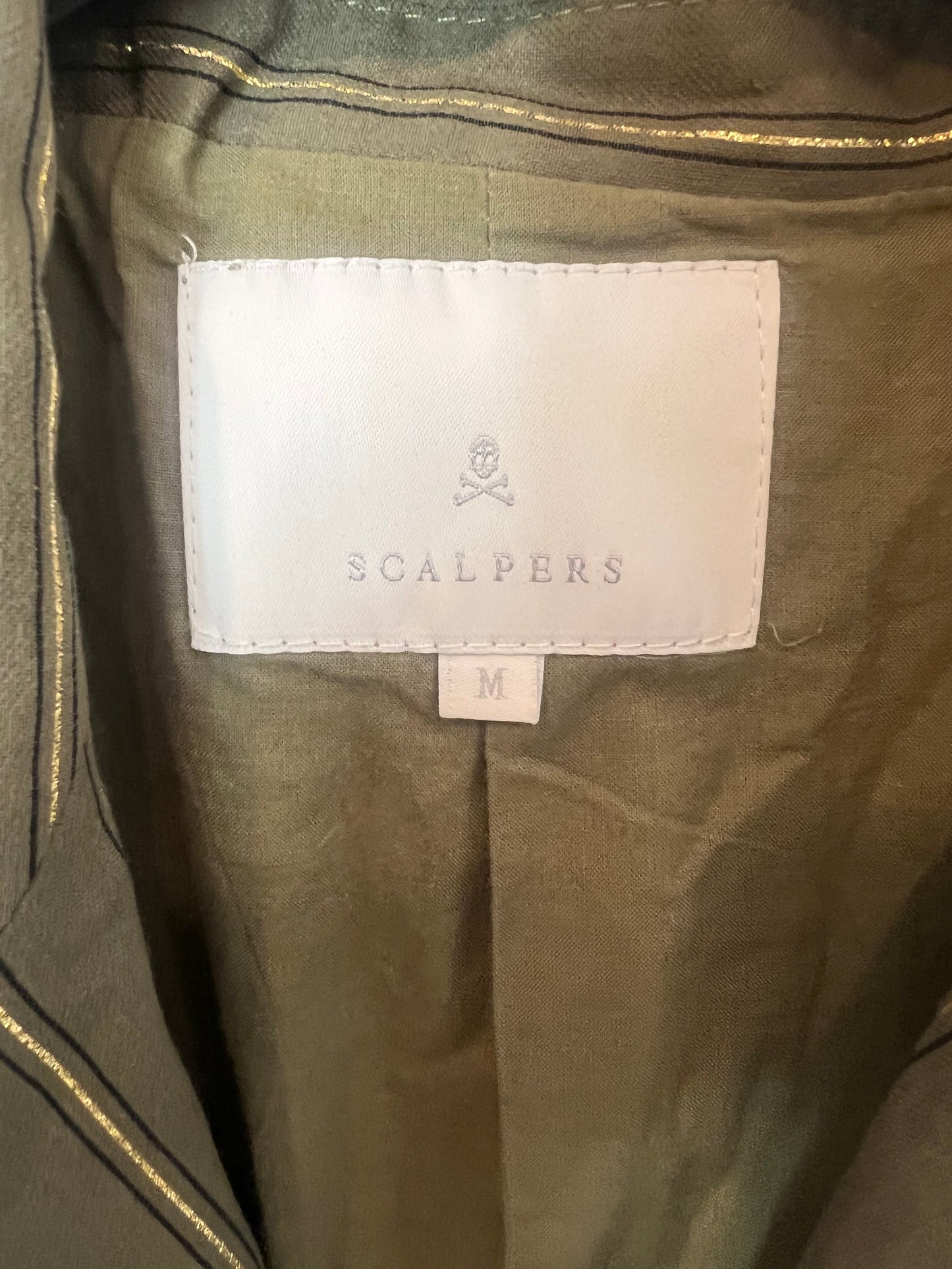 SCALPERS. Striped green vest. TM