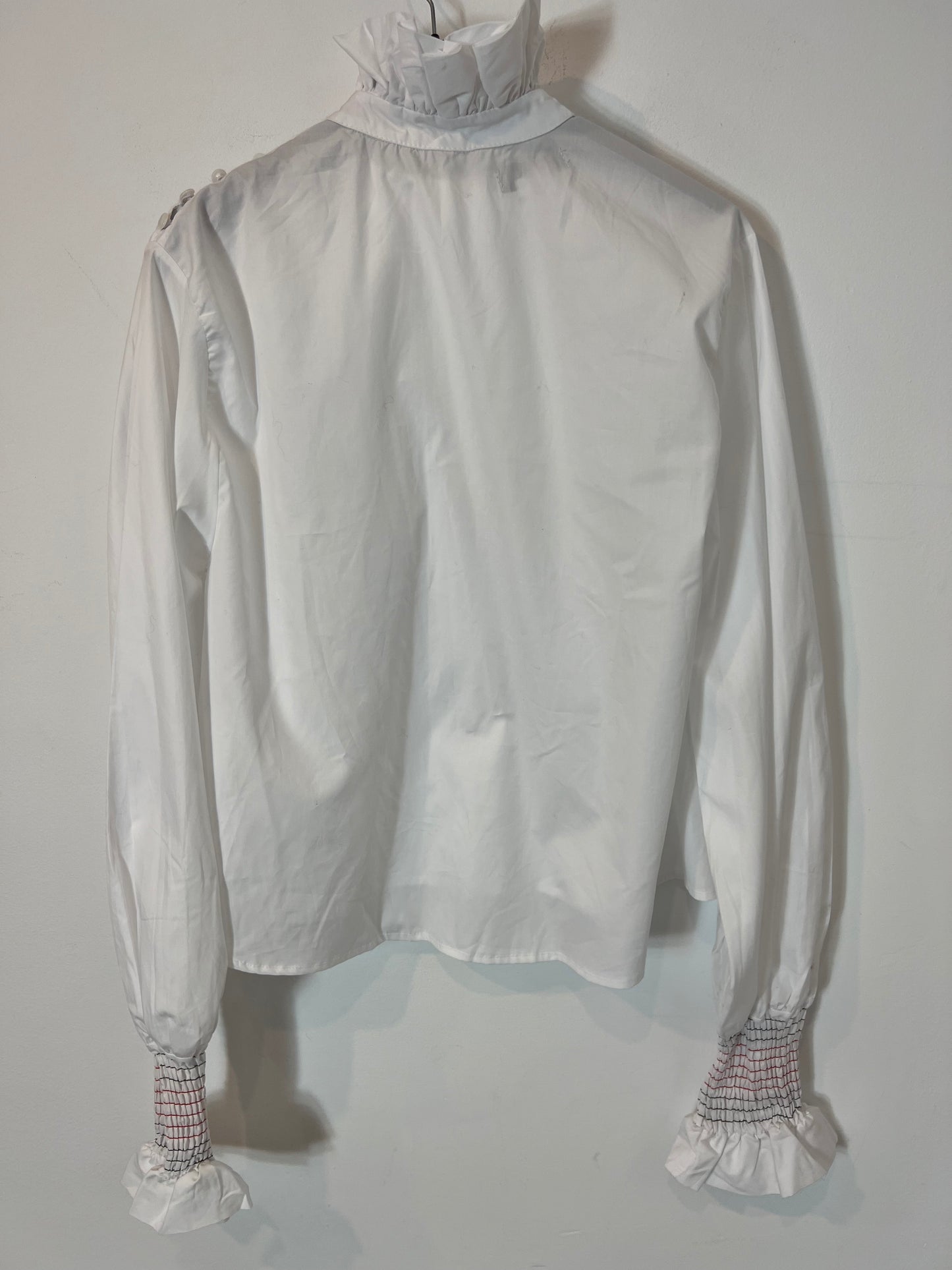 LAGANINI. Blusa blanca volante cuello T.s/m