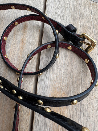 BIMBA Y LOLA. Cinturón fino tachuelas piel. TU