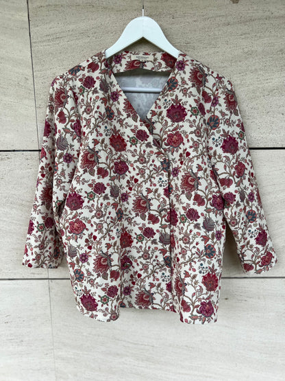 KOTIDIAN. Beige floral crossed Ts blouse