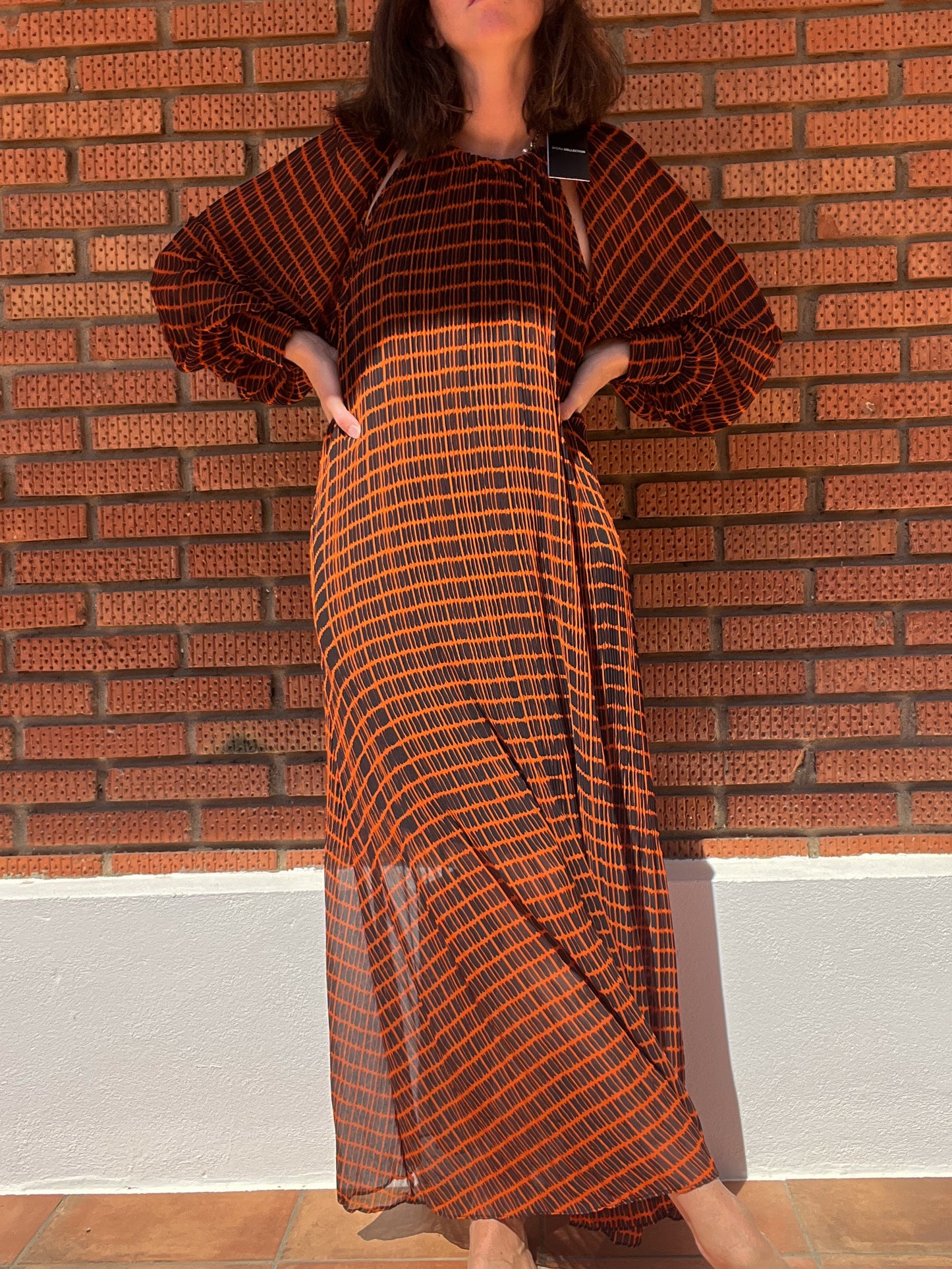 SFERA. Black and orange pleated dress TM