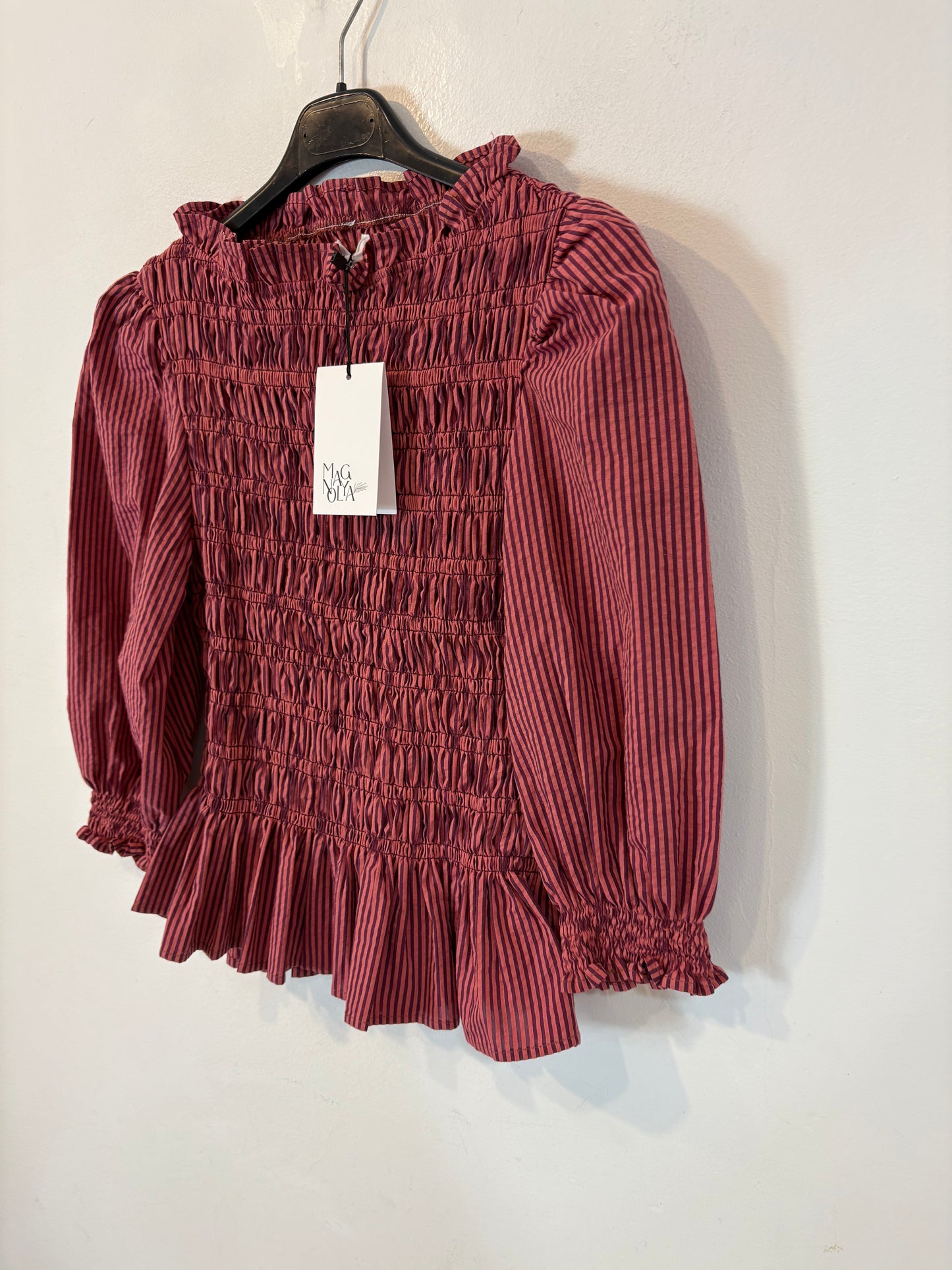 MAGNOLYA. Blusa rosa nido de abeja