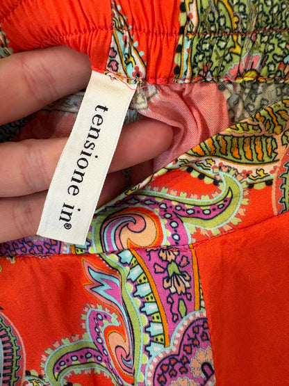 OTRAS. Pantalón fluido naranja estampado
