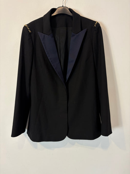 Americana negra detalle cadenas