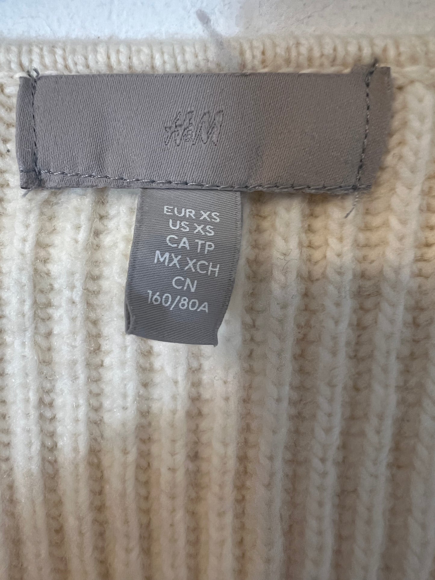 H&M. Top punto beige claro entallado. T XS