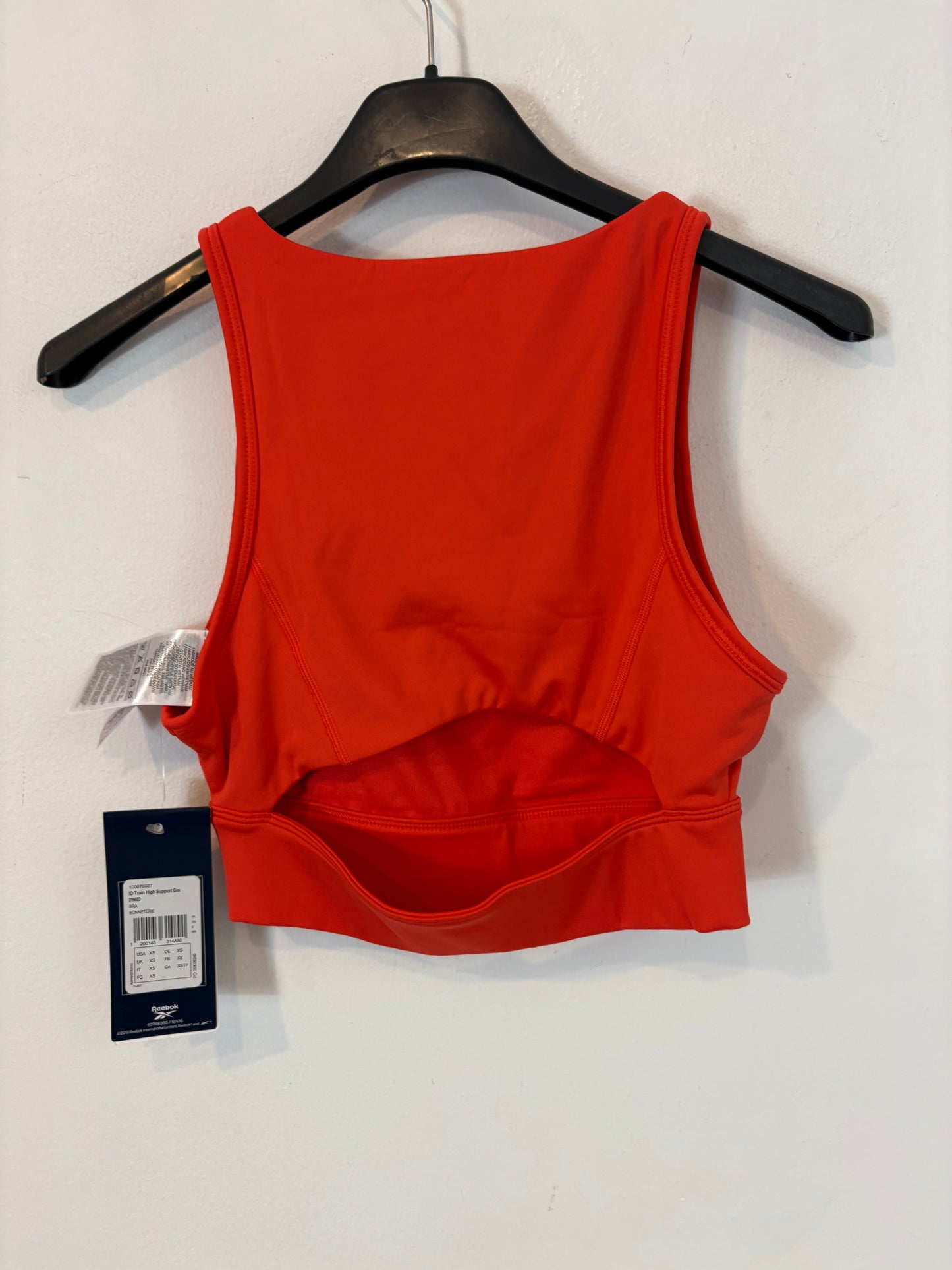 REEBOK. Top deportivo rojo. T XS