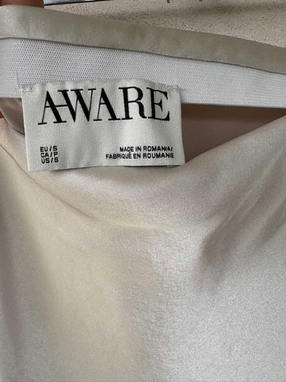 AWARE BARCELONA. Falda larga satina beige