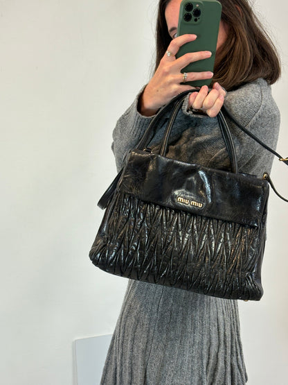MIU MIU. Bolso matelassé piel negro