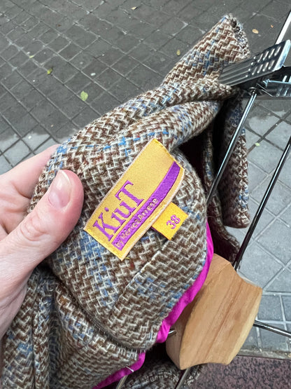 KIUT. Falda midi jaspeada lana