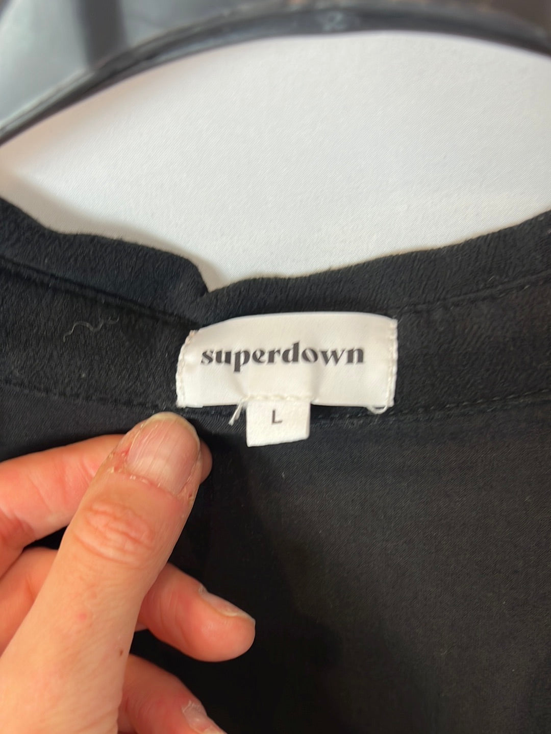 SUPERDOWN. Black open-neck jumpsuit. TL