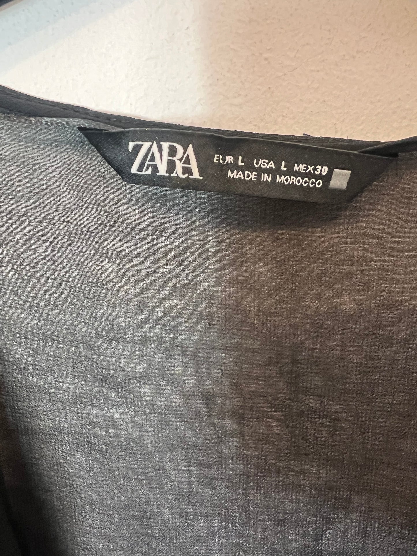 ZARA. Black semi-sheer top with ruffles. TL