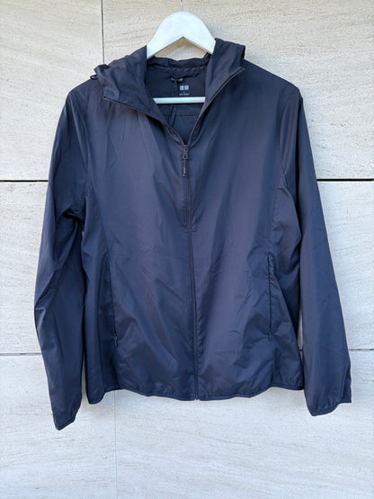 UNIQLO. Navy blue pocketable windbreaker. TL