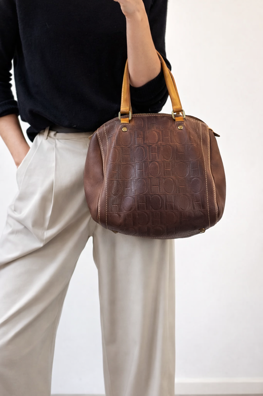 CAROLINA HERRERA. Bolso de mano marrón anagrama