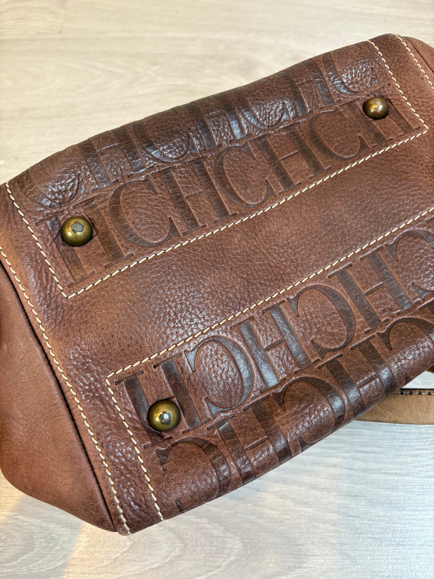 CAROLINA HERRERA. Bolso de mano marrón anagrama