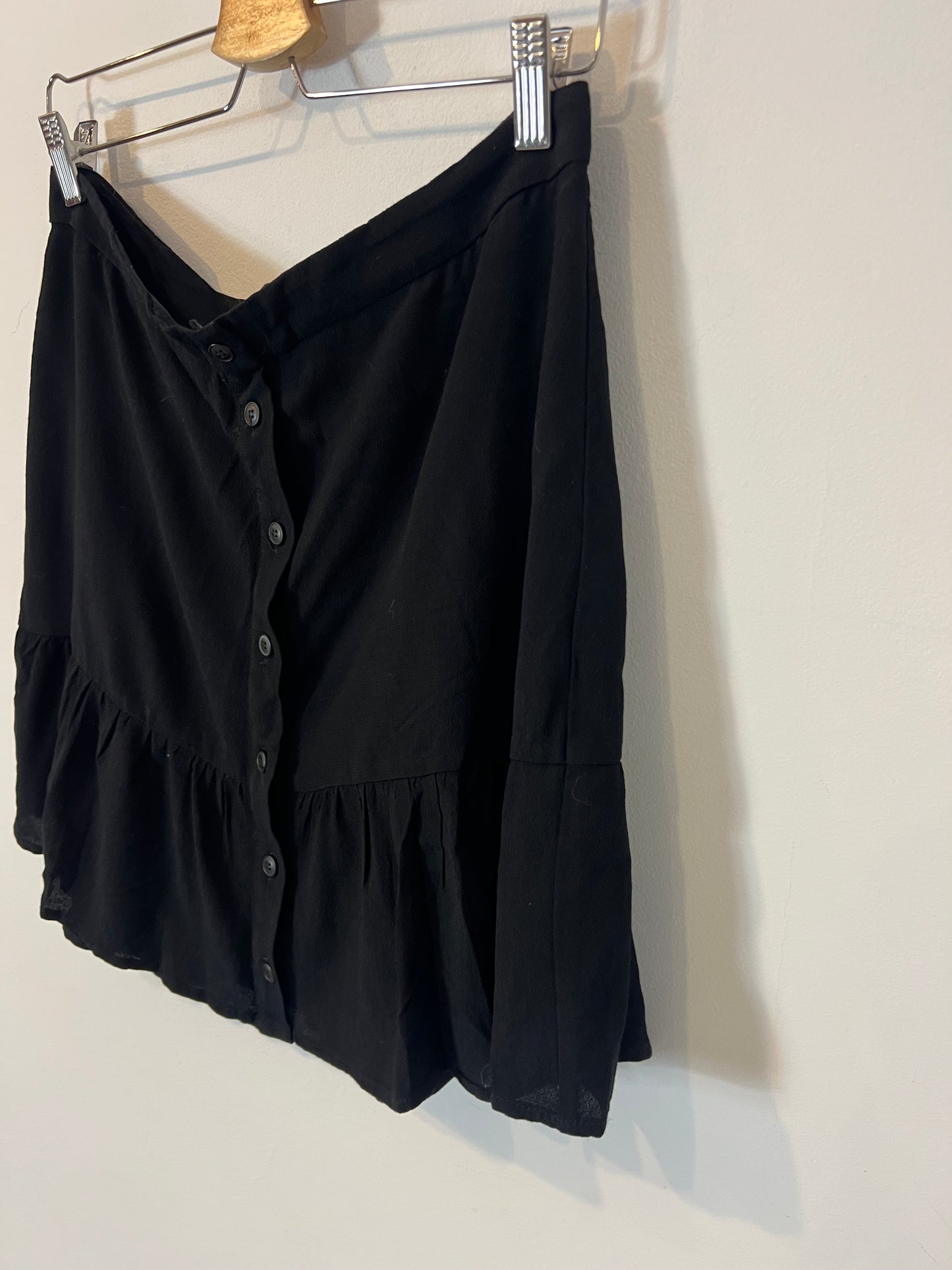 THAT OR THAT. Flowing black buttoned skirt. TL