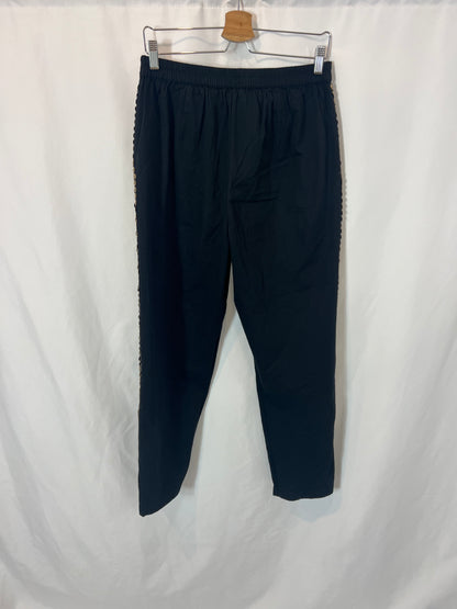 MES DEMOISELLES. Black trousers with stud detail. Size 40