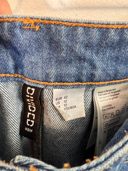 H&M. Falda denim abotonada. T 42