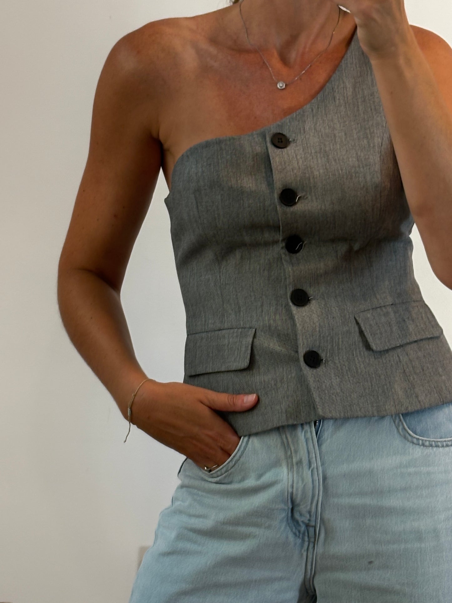 ZARA. Chaleco gris asimétrico. T S