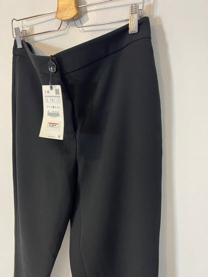 ZARA. Pantalones negros aberturas. T L