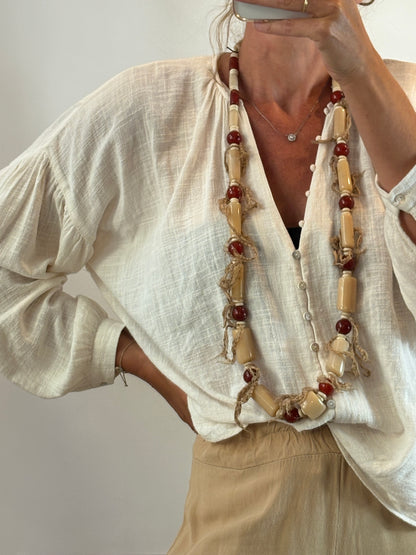 OTRAS. Collar largo flecos