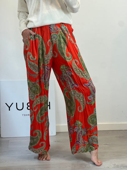 OTRAS. Pantalón fluido naranja estampado