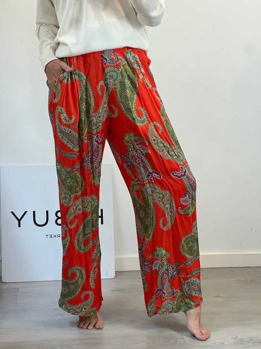OTRAS. Pantalón fluido naranja estampado