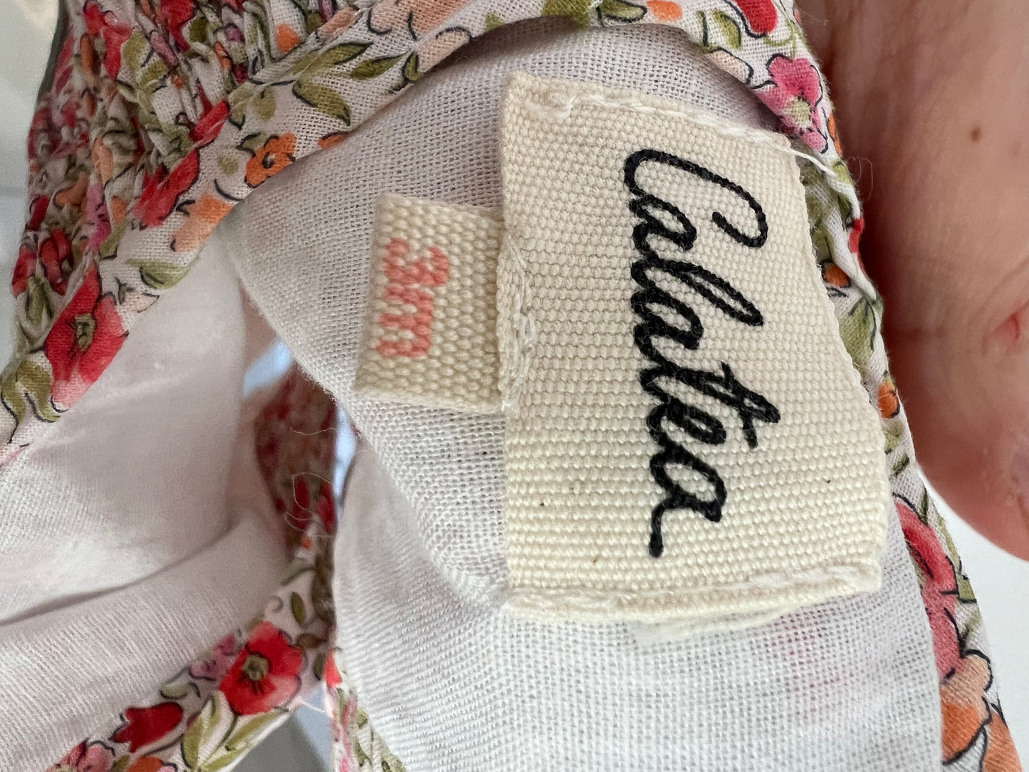 CALATEA. Flower-necked romper, 3 months old