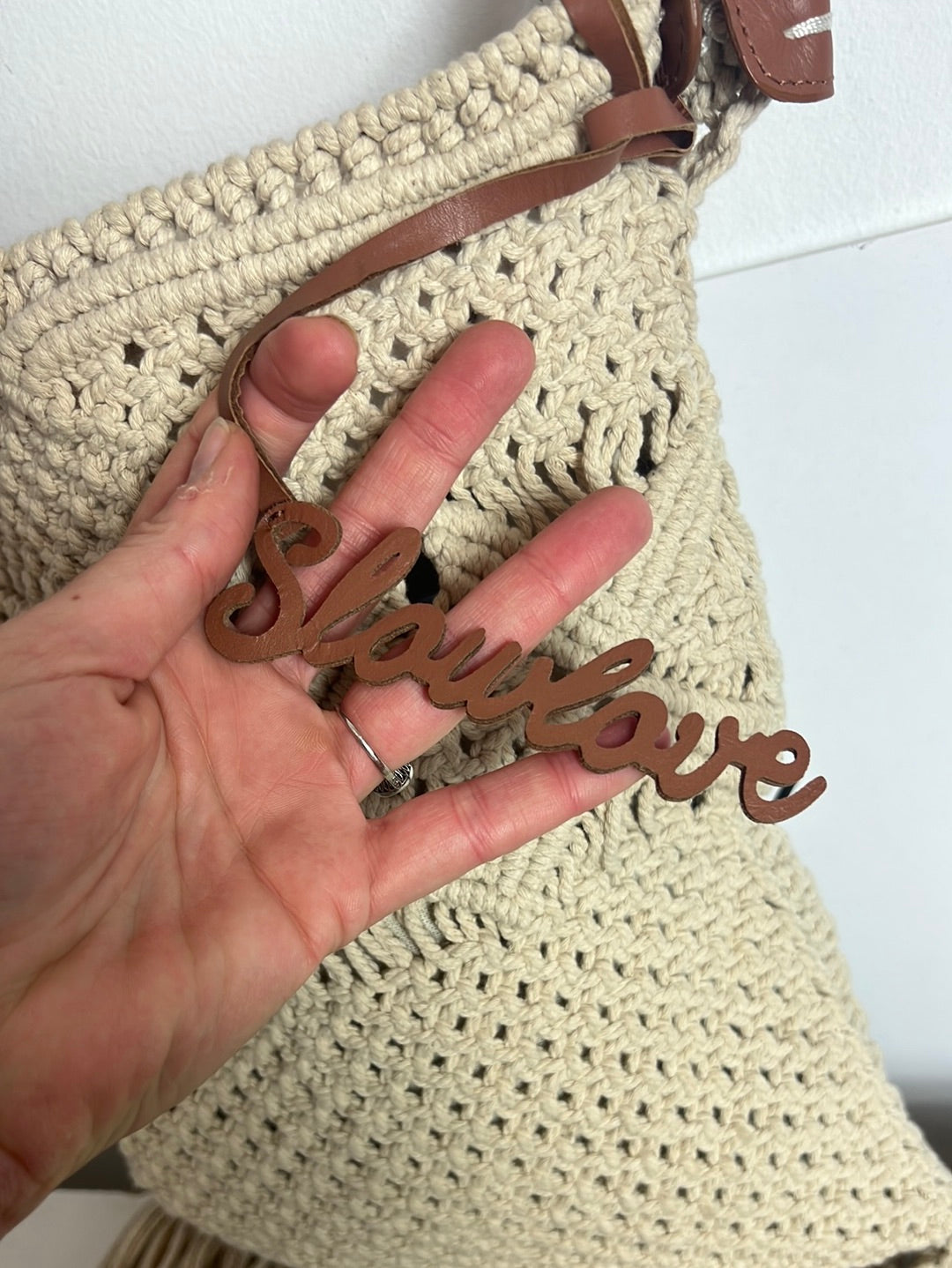 SLOWLOVE. Beige braided bag with fringes