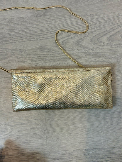 ANGARI. Cartera de mano dorada