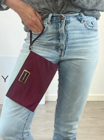 BIMBA Y LOLA. Cartera de mano burdeos