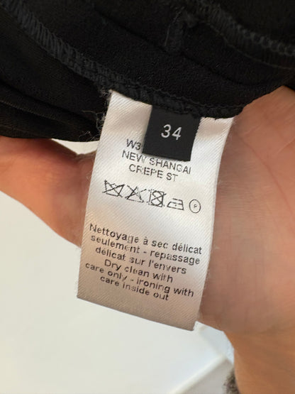 JOSEPH. Pantalón negro fluido detalles en piel