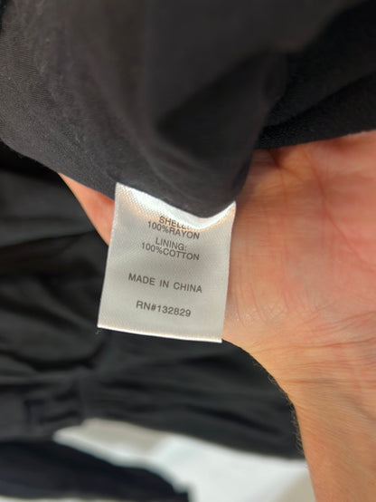 SUPERDOWN. Black open-neck jumpsuit. TL