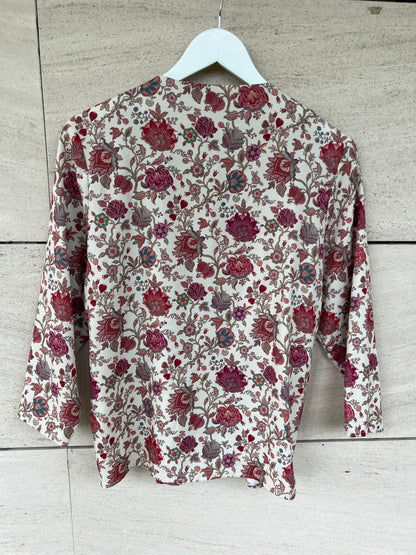KOTIDIAN. Beige floral crossed Ts blouse