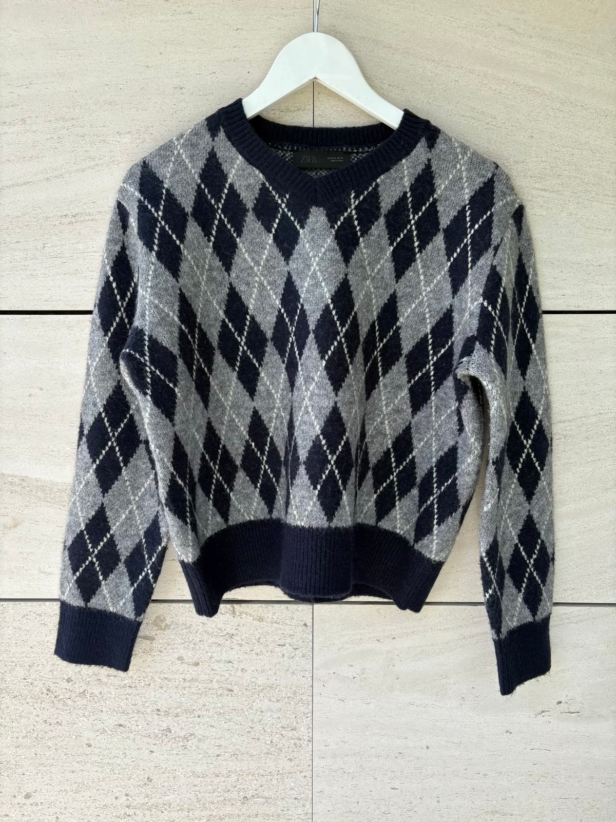 ZARA. Jersey azul rombos