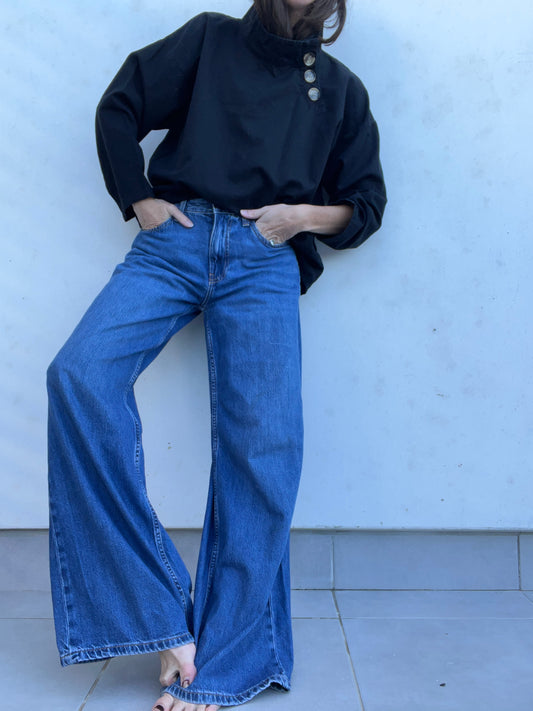 BERSHKA. Pantalón denim ancho