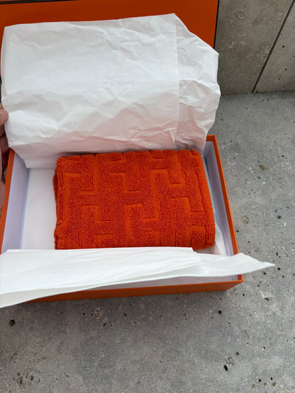 HERMES. Toalla de invitados en naranja