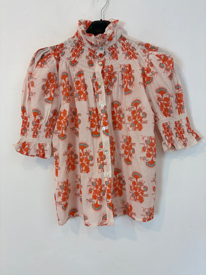 OTRAS. Blusa estampada nido de abeja