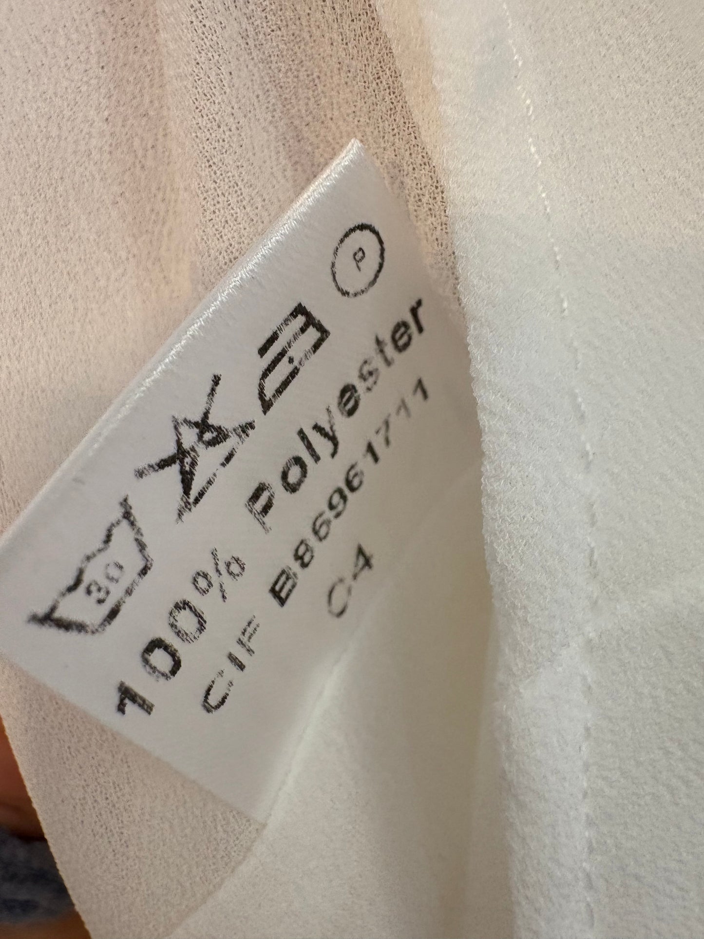 BIMANI. Blusa blanca escote fluido