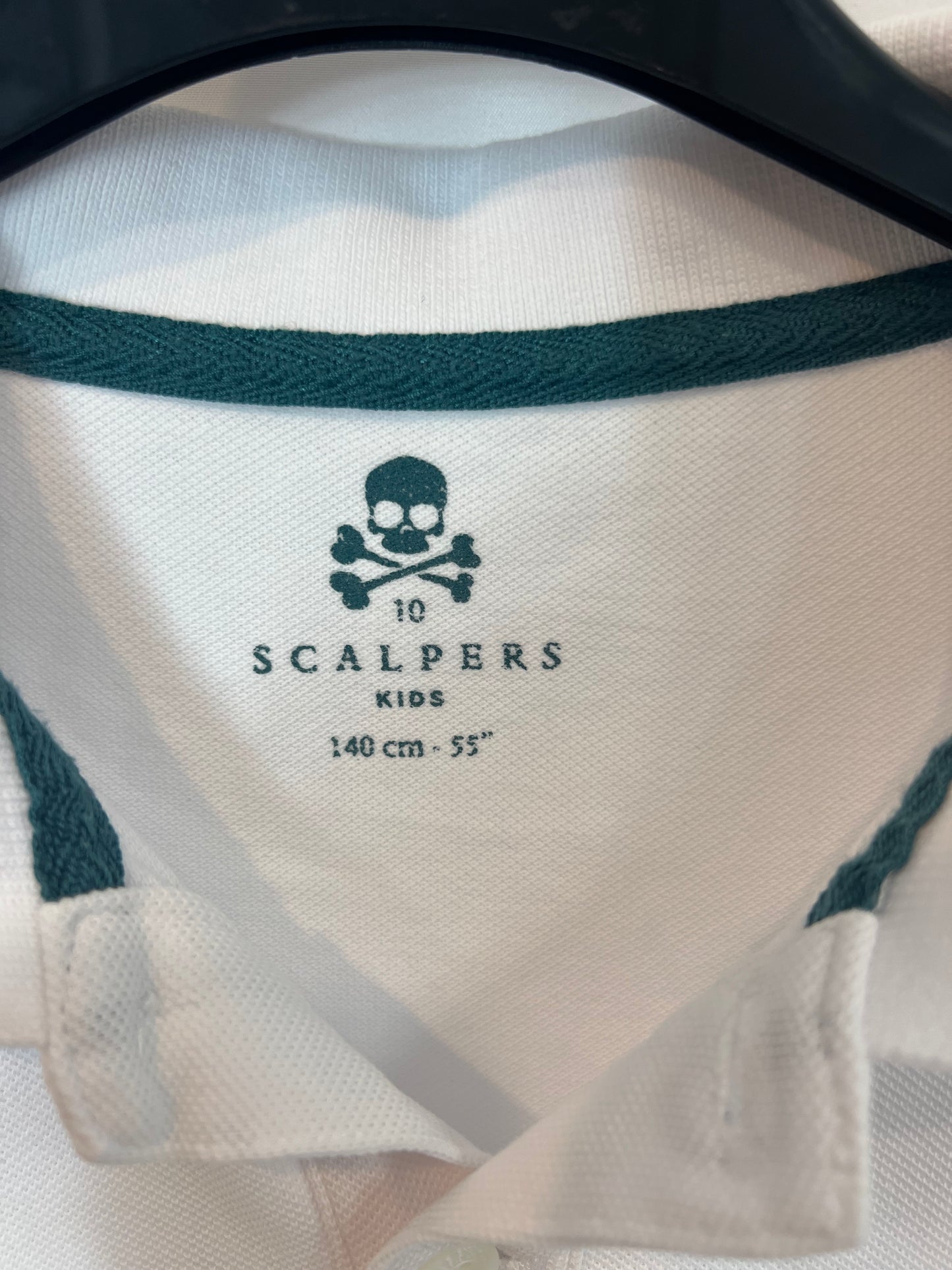 SCALPERS. White polo shirt with green logo. 10 years old.