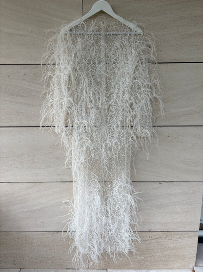 ALICIA RUEDA. Vestido plumas